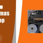 Parte de baixo de um robô aspirador com dois mops rotativos, um deles estendido para a borda